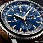 브라이틀링 네비타이머 모델 비교 - A high-resolution close-up of a luxury Navitimer wristwatch on a polished wooden surface, showcasing...