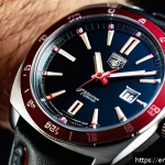 태그호이어 몬자와 포뮬러1 비교 - A close-up, highly detailed image of a Tag Heuer Monza watch on a wrist, showcasing its vintage cush...